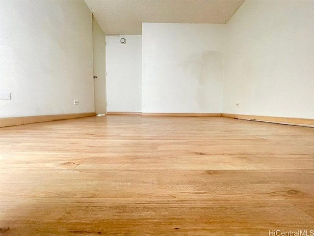 spare room featuring light hardwood / wood-style flooring