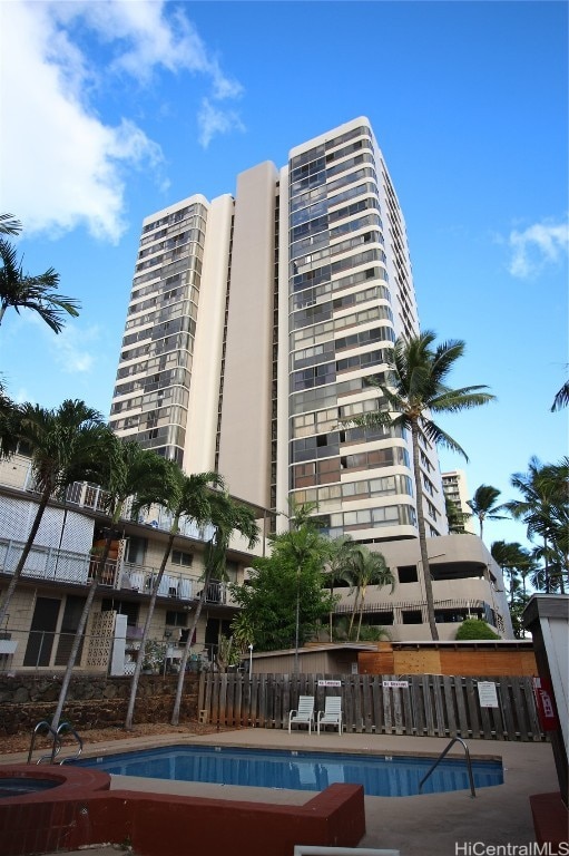 view of property featuring a community pool