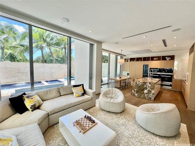 1118 Ala Moana Blvd Unit 2, Honolulu, HI 96814 - living area with recessed lighting and wood finished floors