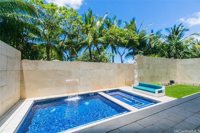 view of pool with an in ground hot tub and pool water feature