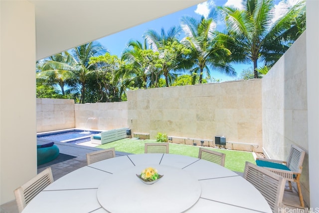 view of patio / terrace featuring a fenced in pool