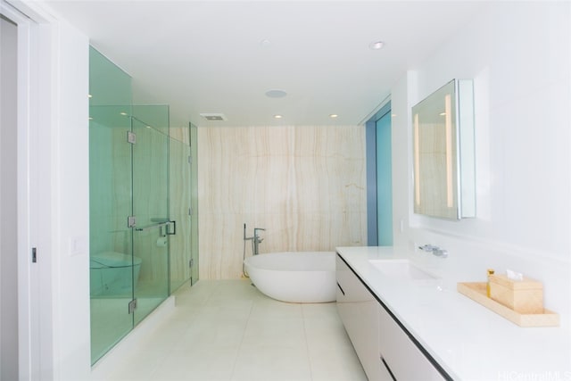 bathroom with vanity, tile patterned floors, and independent shower and bath