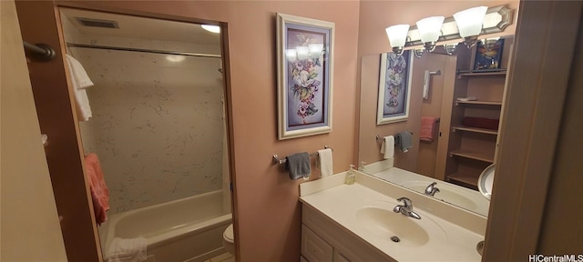 full bathroom featuring toilet, vanity, and tub / shower combination