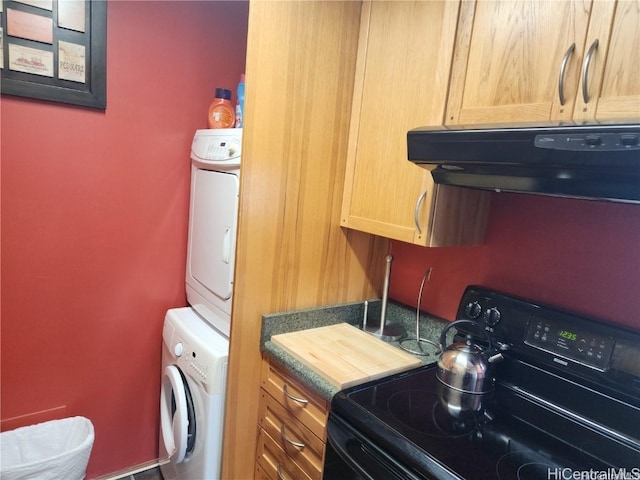 washroom with stacked washer / dryer