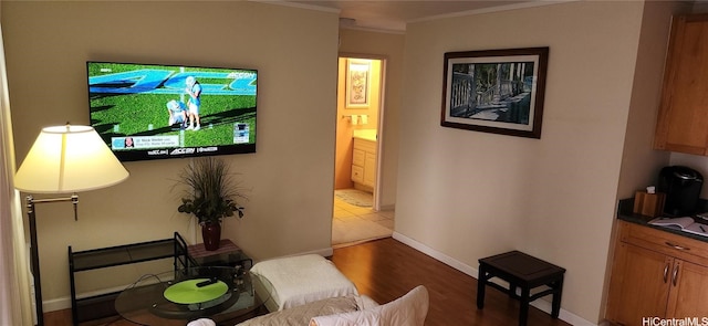 living room featuring ornamental molding and hardwood / wood-style floors