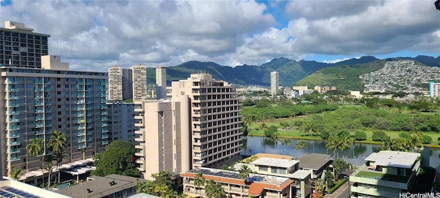 exterior space with a water and mountain view