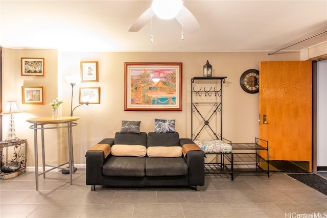 tiled living room with ceiling fan