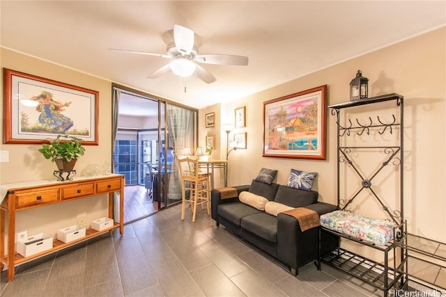 living area featuring ceiling fan and hardwood / wood-style flooring