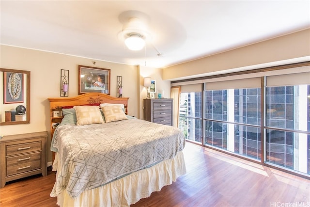 bedroom featuring wood-type flooring and ceiling fan