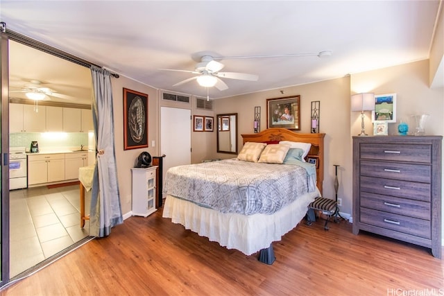 bedroom featuring light hardwood / wood-style flooring and ceiling fan