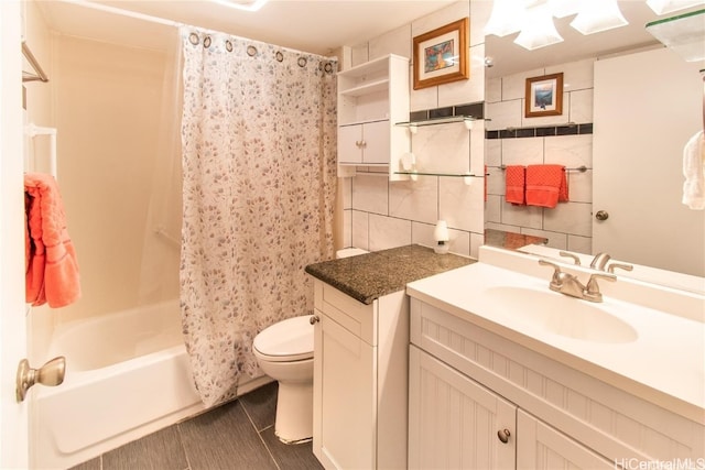 full bathroom featuring shower / bath combination with curtain, toilet, tile walls, vanity, and tile patterned flooring