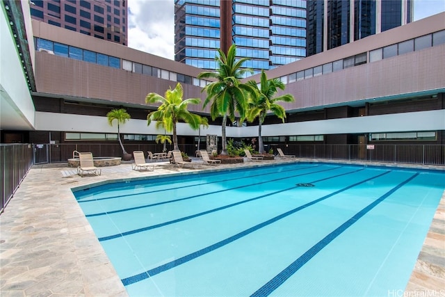 view of swimming pool with a patio