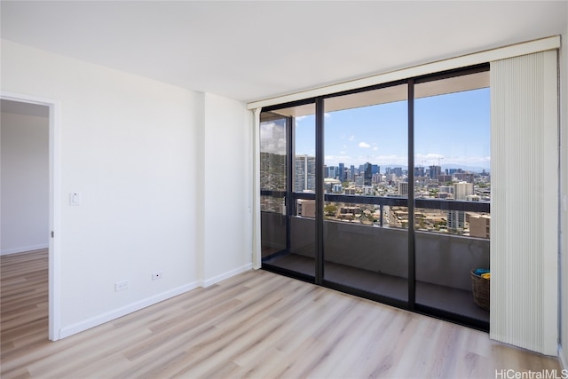 unfurnished room featuring light hardwood / wood-style floors