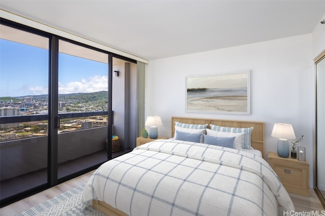 bedroom with light hardwood / wood-style floors