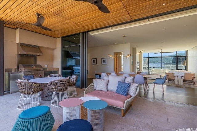 view of patio featuring ceiling fan, grilling area, and outdoor lounge area