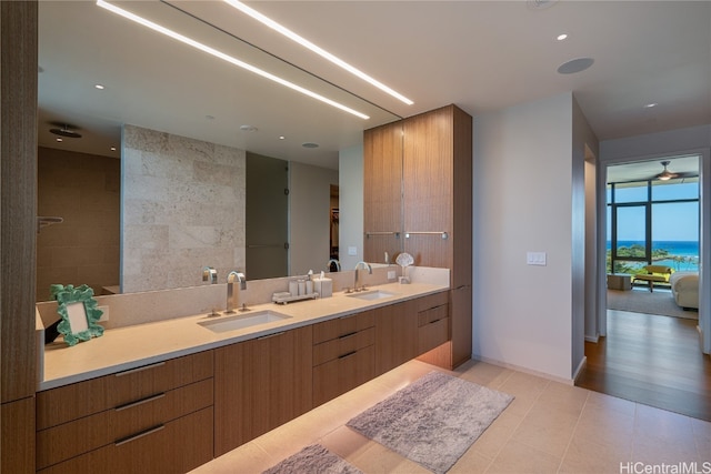 bathroom featuring tile walls, vanity, and wood-type flooring