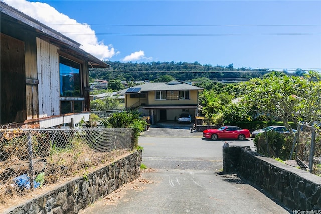 view of front of property with fence and driveway