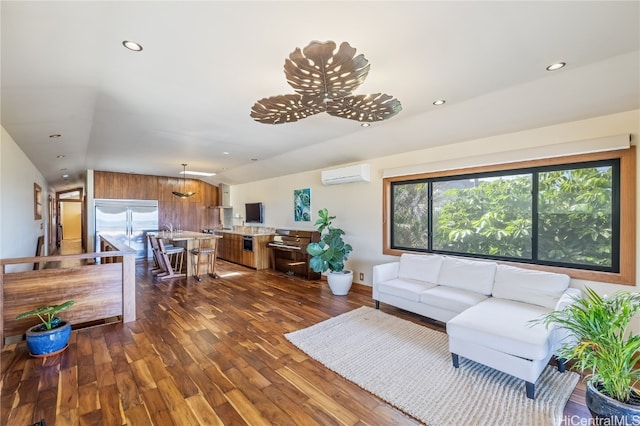 living room featuring dark wood-type flooring, a wall mounted AC, and vaulted ceiling