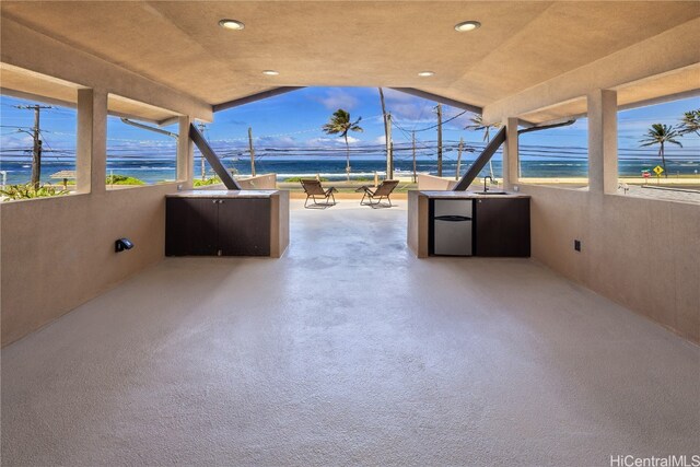 view of patio / terrace featuring a water view