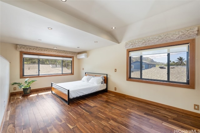 unfurnished bedroom featuring dark wood-type flooring and a wall mounted AC