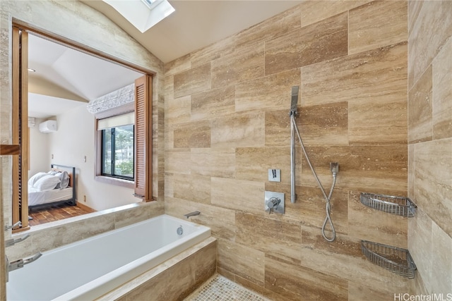 bathroom featuring lofted ceiling with skylight and independent shower and bath