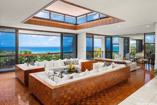 sunroom featuring a water view