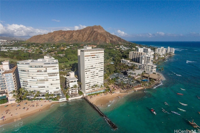 bird's eye view featuring a view of the beach and a water and mountain view