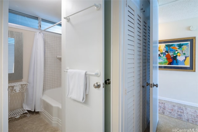 bathroom featuring tile patterned floors and shower / tub combo