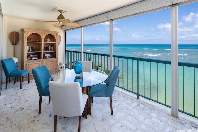 sunroom with a water view