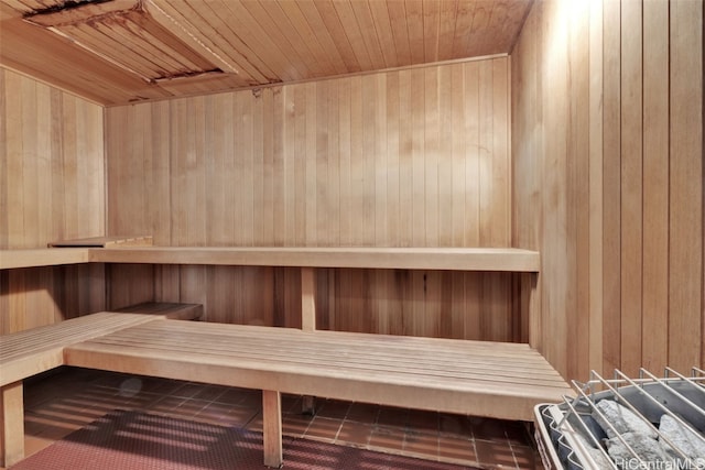 view of sauna / steam room with wooden walls and wood ceiling