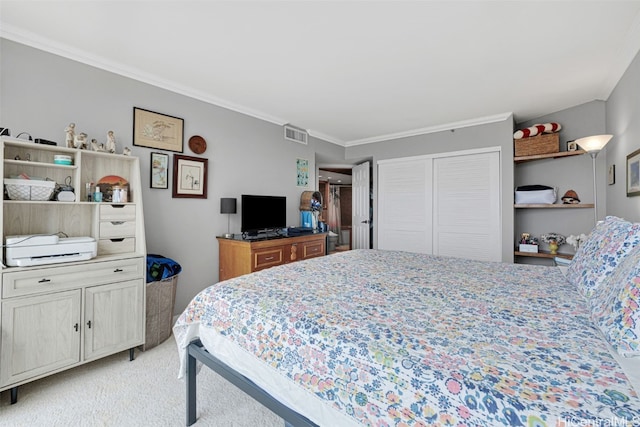 bedroom with crown molding, light carpet, and a closet