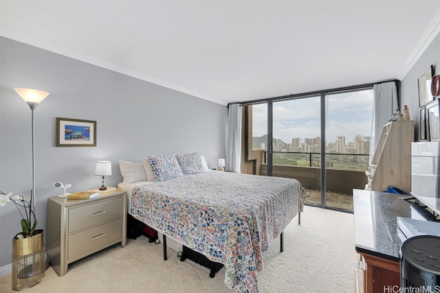 carpeted bedroom with ornamental molding, expansive windows, and access to outside