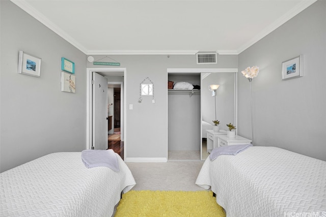 bedroom with a closet, crown molding, and light carpet