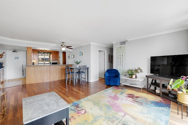 581 Kamoku St Unit 2402, Honolulu, HI 96826 - living area with ornamental molding, wood finished floors, and ceiling fan