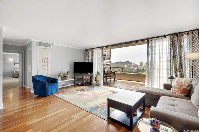 581 Kamoku St Unit 2402, Honolulu, HI 96826 - living area with wood finished floors and crown molding