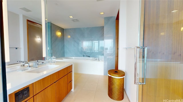 bathroom featuring tile walls, vanity, shower with separate bathtub, and tile patterned floors