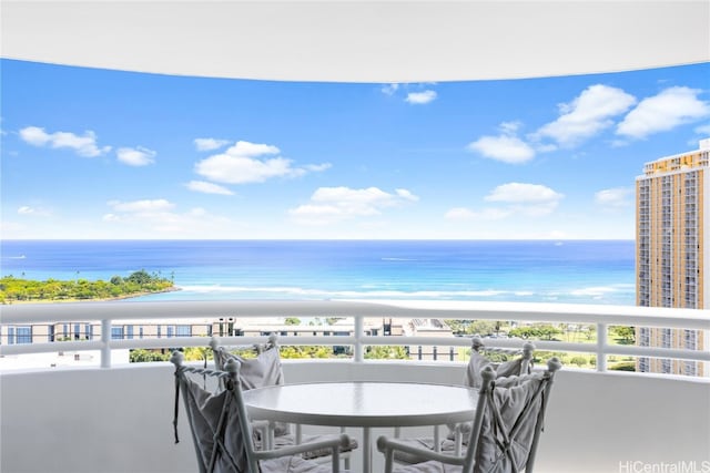 balcony with a view of the beach and a water view