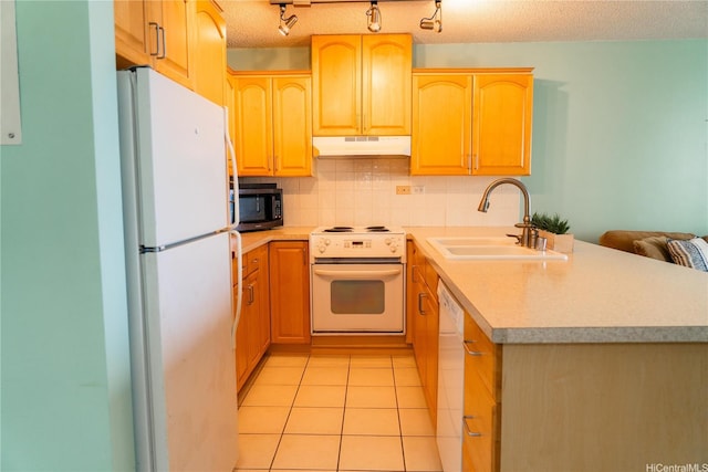 2140 Kuhio Ave Unit 1907, Honolulu, HI 96815 - kitchen with white appliances, under cabinet range hood, a sink, a peninsula, and light brown cabinets