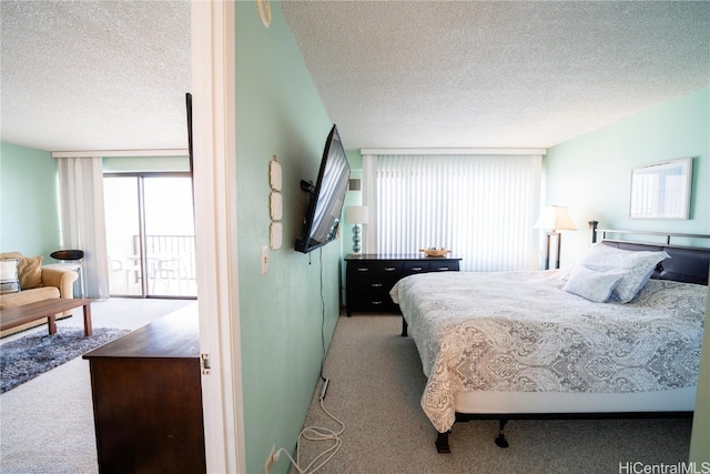 carpeted bedroom with a textured ceiling