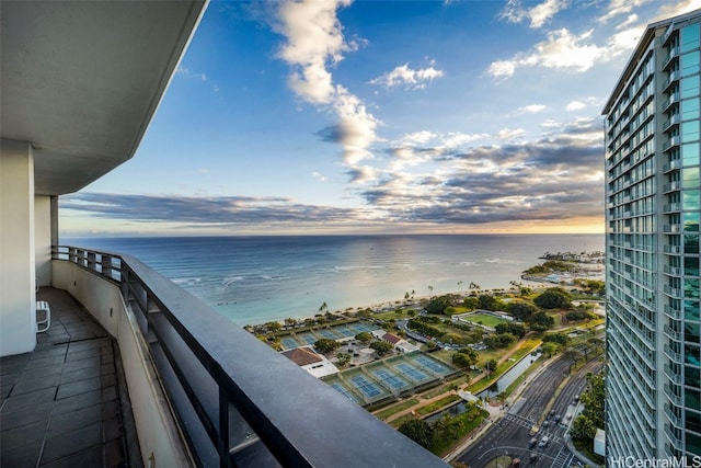 balcony featuring a water view