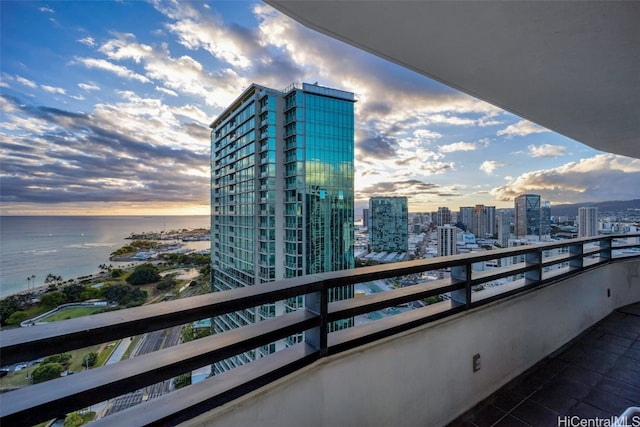 balcony at dusk with a water view