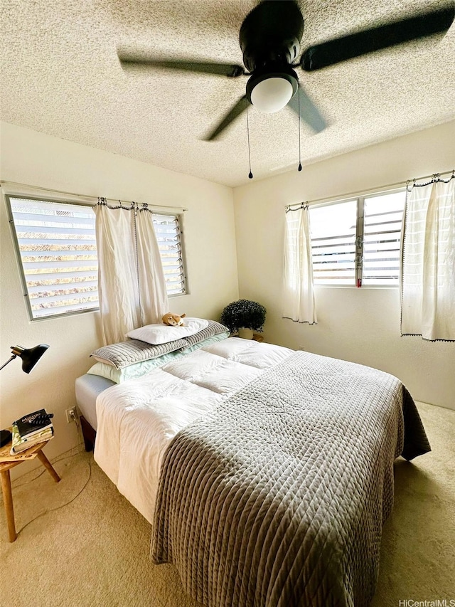 86-283 Hokuaiaina Pl, Waianae, HI 96792 - bedroom featuring carpet floors, ceiling fan, and a textured ceiling