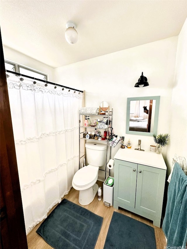 86-283 Hokuaiaina Pl, Waianae, HI 96792 - bathroom featuring wood finished floors, toilet, curtained shower, and vanity