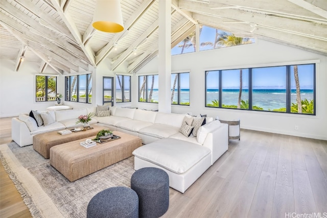 living room featuring lofted ceiling with beams, a water view, wood ceiling, and light hardwood / wood-style flooring