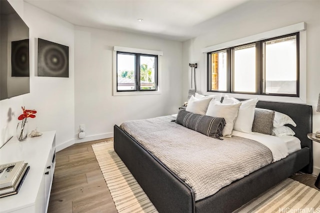 bedroom featuring light wood-type flooring