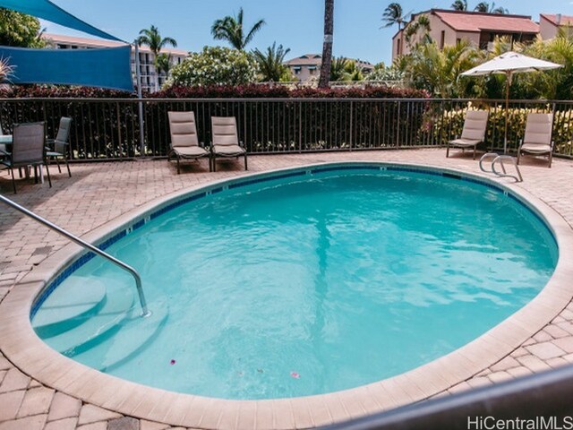 view of swimming pool featuring a patio