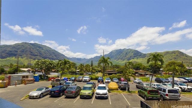 view of parking / parking lot with a mountain view