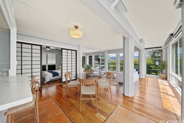 sunroom with ceiling fan and a wealth of natural light