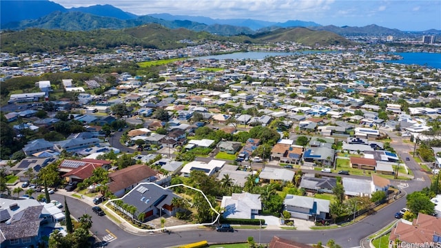 bird's eye view with a water and mountain view