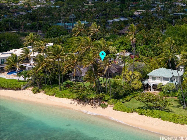 aerial view with a water view and a beach view